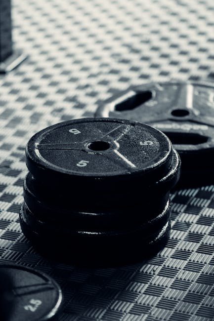 Stacked weight plates illustrating heavy-duty financial stability